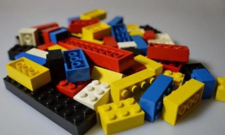 A small pile of different coloured lego blocks
