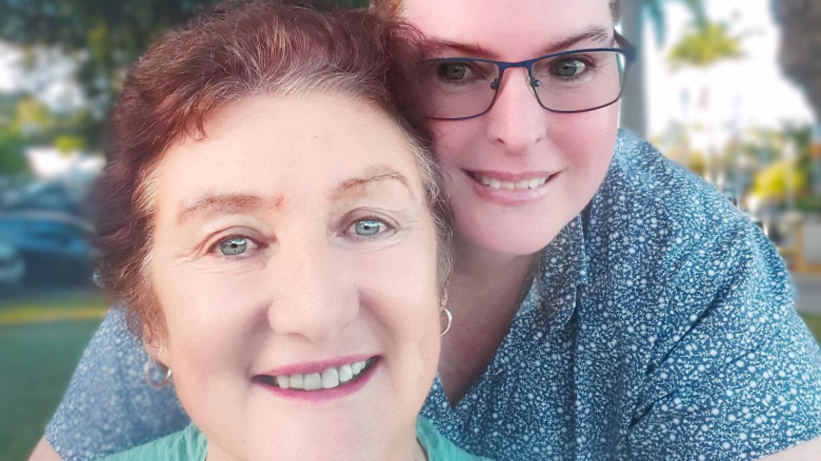 Dementia Australia Advisory Committee member Jenni and her partner Tracy outside smiling.