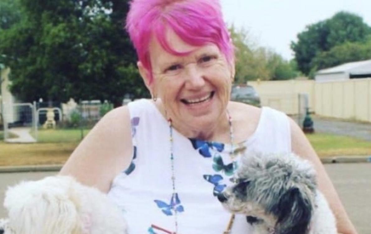 Dementia Advocate Gwenda Darling holding her two dogs.