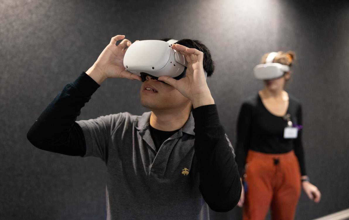 Two people wearing VR headsets experience Enabling EDIE.