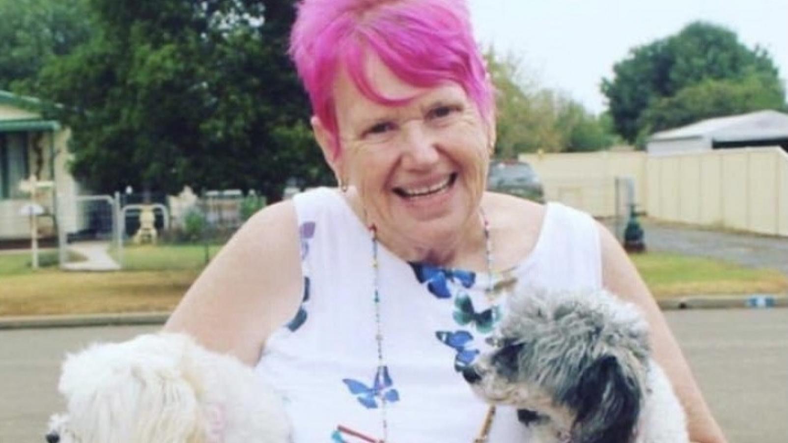 Dementia Advocate Gwenda Darling holding her two dogs.