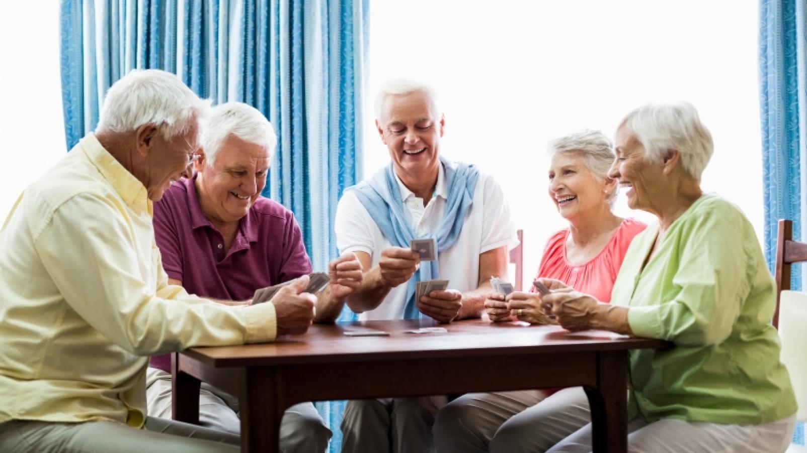 elderly friends playing poker